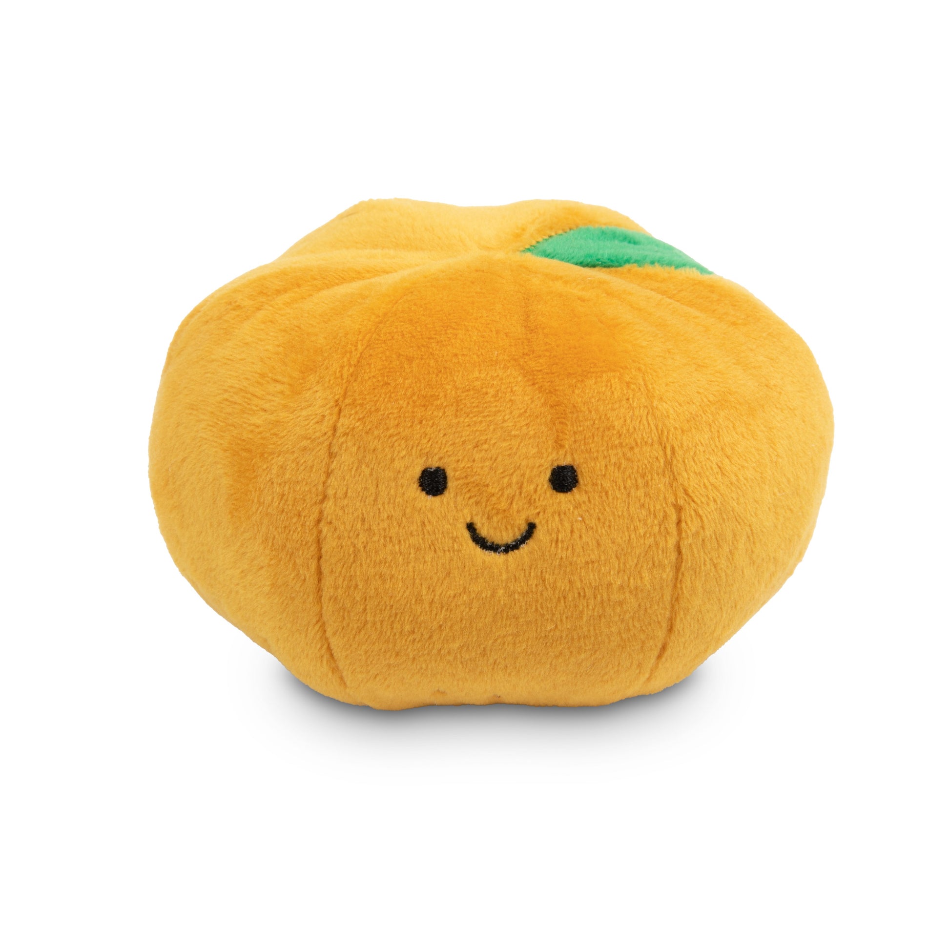 Plush toy resembling a pumpkin with a smiley face on a white background